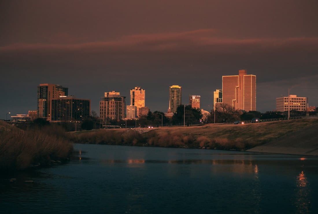 The downtown Fort Worth, Texas skyline at dusk over the Trinity River
