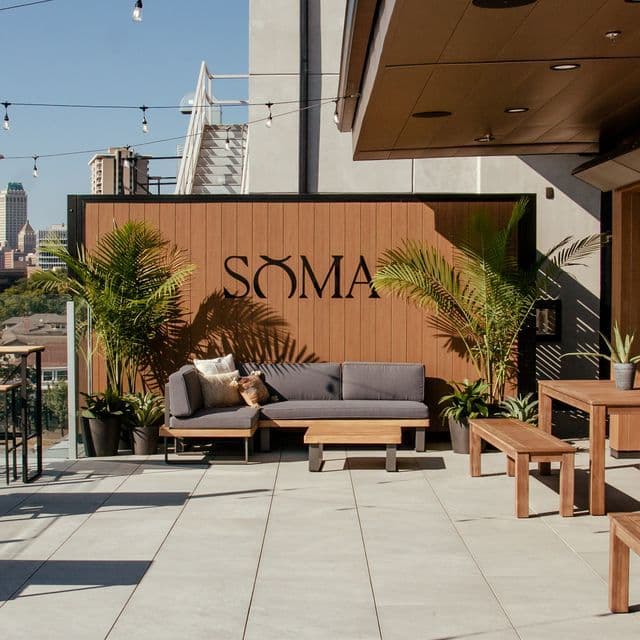 Couples dining on a beautiful outdoor patio at Utica Square, upscale casual date night ideas in Tulsa, local singles activities