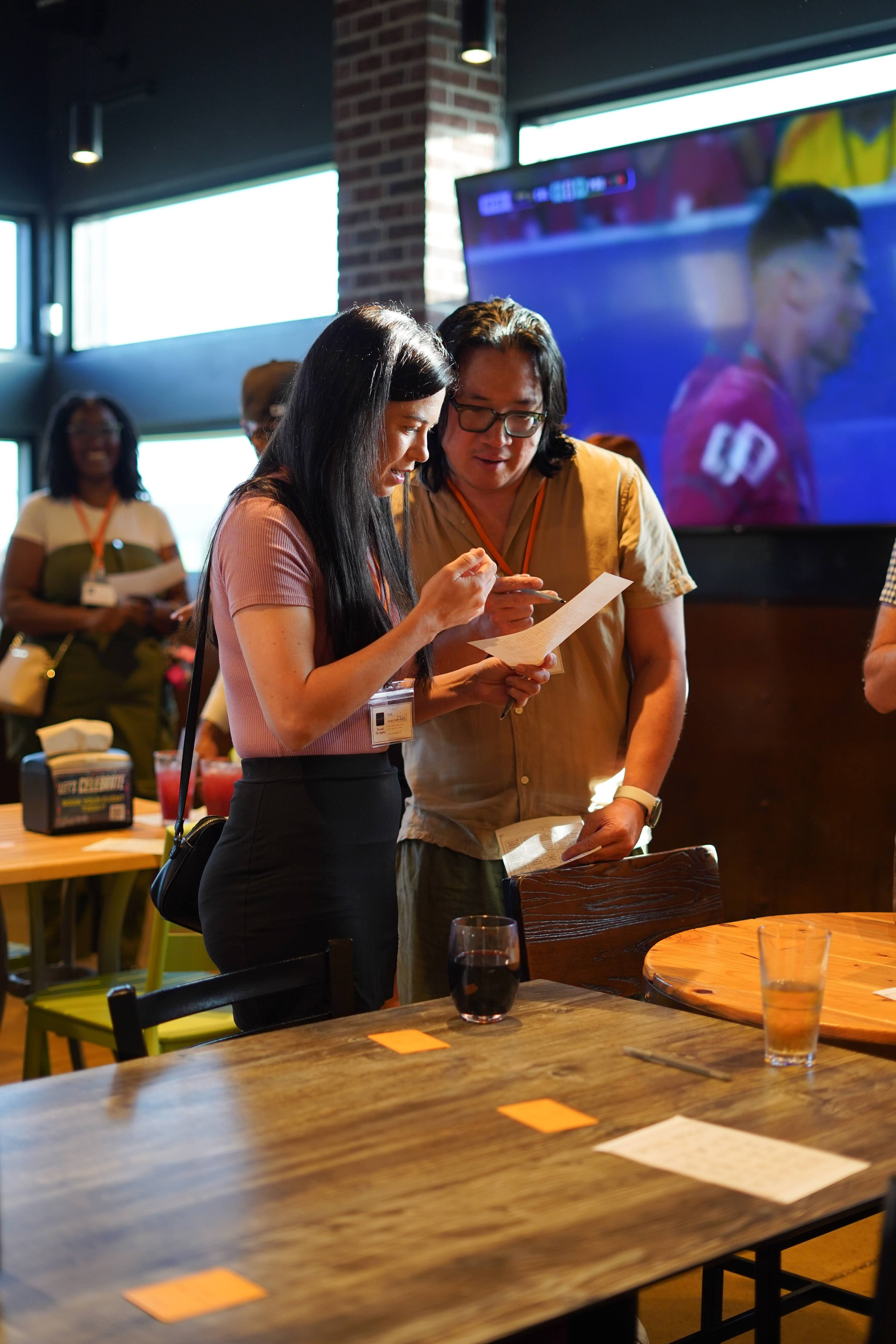 Man and woman talking face-to-face at a local singles mixer, escaping dating app fatigue by finding real-world connections in Oklahoma