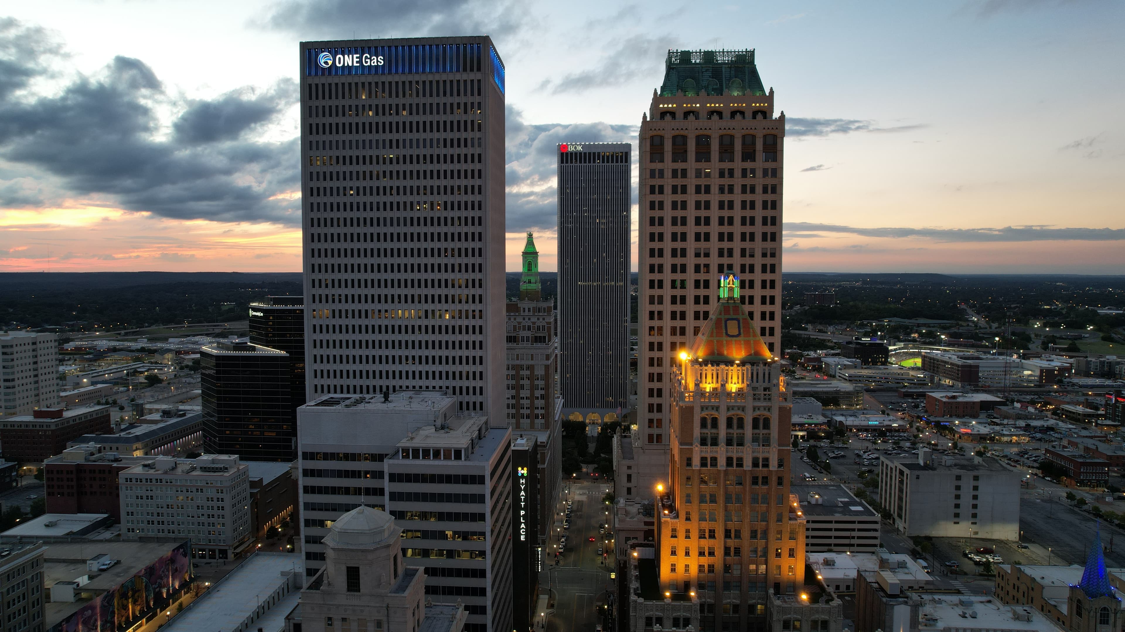 Sunset views of downtown Tulsa buildings, Beyond The Sparks compatibility matching and singles events at Cabin Boys Brewpub